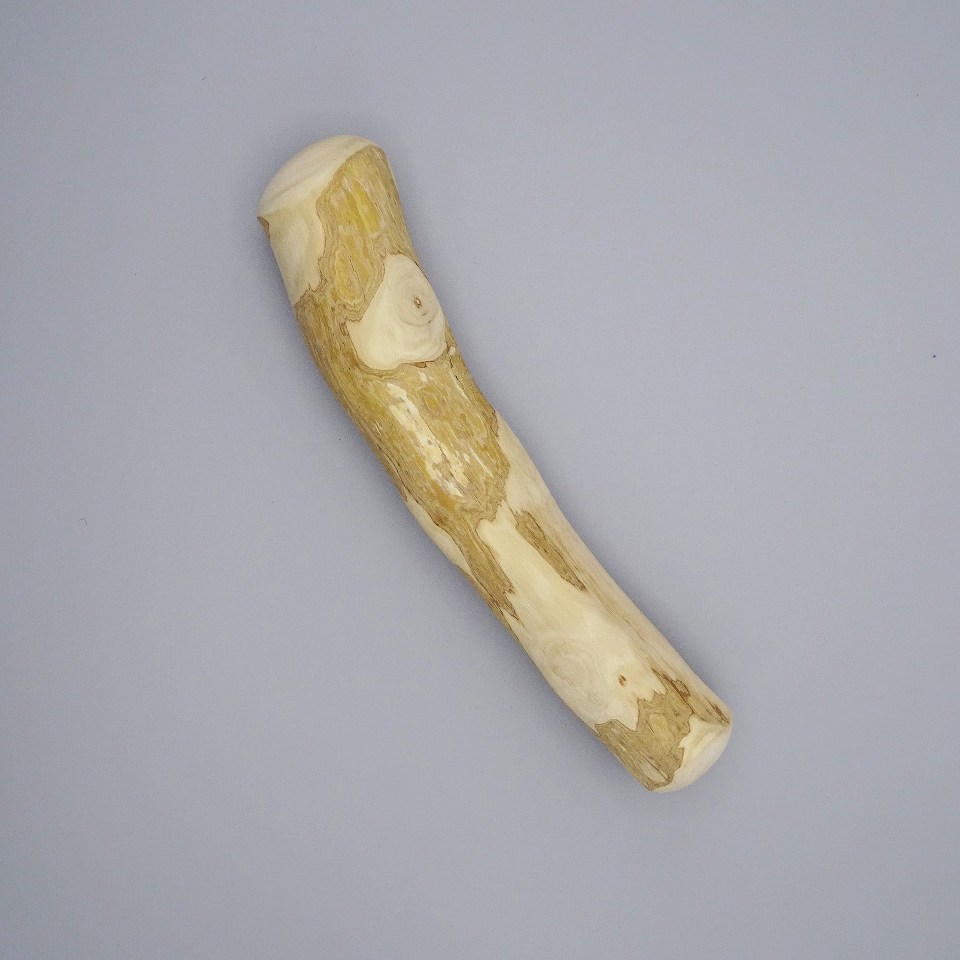 Large coffee wood sticks with natural grain on a gray background 