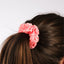 woman wearing Pink fleck hair scrunchie